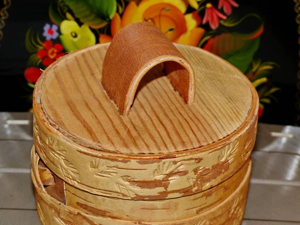 Tuesok - a small birch-bark box with lid. For storage of loose products. Closeup. Folk craft Russia. Retro.