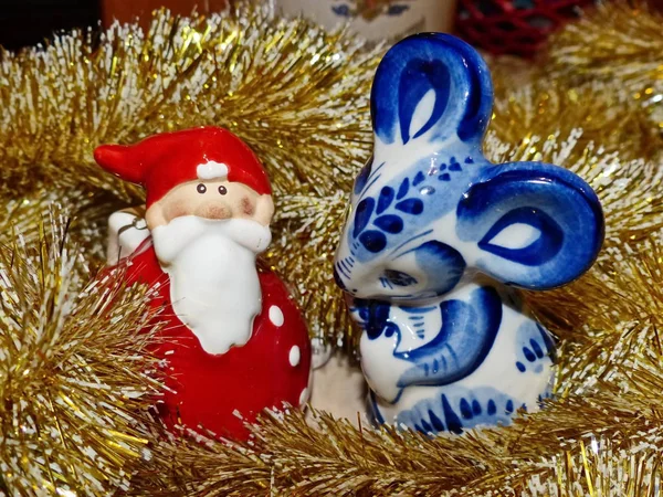Santa Claus and the Symbol of the new year 2020 White rat (mouse) on the Eastern calendar. Gzhel - Russian folk craft of ceramics and production porcelain and a kind of Russian folk painting.