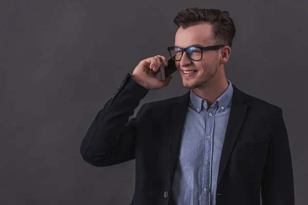 Handsome Young Businessman Suit Eyeglasses Talking Mobile Phone Smiling Gray — Stock Photo, Image