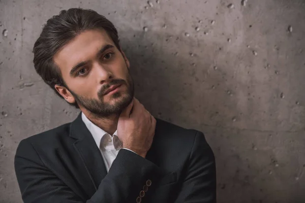 Handsome Confident Businessman Bristle Suit Touching His Neck Looking Away — Stock Photo, Image