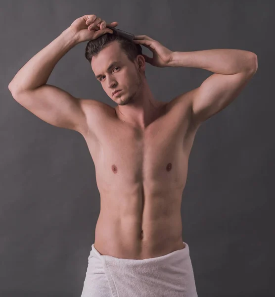 Handsome Young Man Wrapped Towel Combing His Hair Looking Camera — Stock Photo, Image