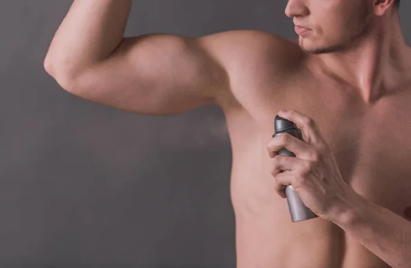 Cropped Image Handsome Young Man Bare Torso Using Antiperspirant Gray — Stock Photo, Image