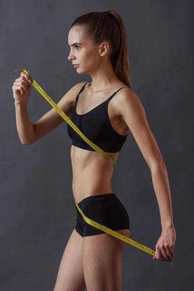 Beautiful Slim Girl Sportswear Holding Tape Measure Gray Background — Stock Photo, Image