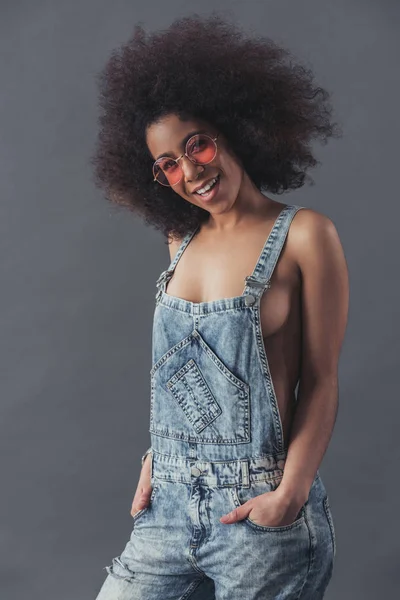 Afro American woman in jean overalls — Stock Photo, Image