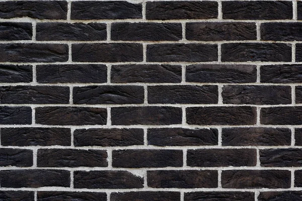 Zwarte muur van bakstenen horizontaal verwijderd om tekst te schrijven — Stockfoto