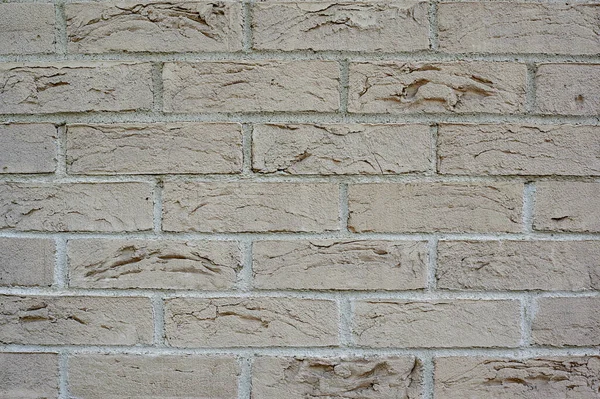 grey brick wall close-up filmed horizontally tekst