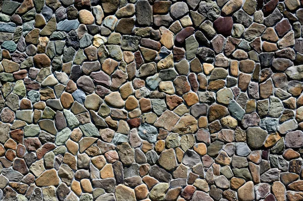 Of different stones and sizes stone old wall horizontally close up — Stock Photo, Image