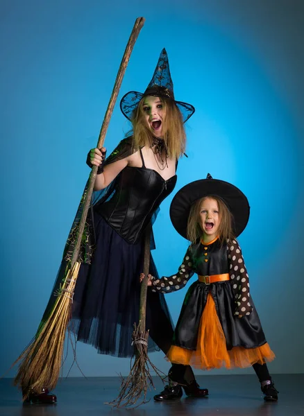 Mom and daughter in costumes for a holiday of halloween
