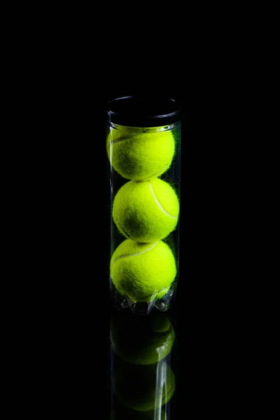 Tennis Ball isolated on black with dramatic lighting — Stock Photo, Image