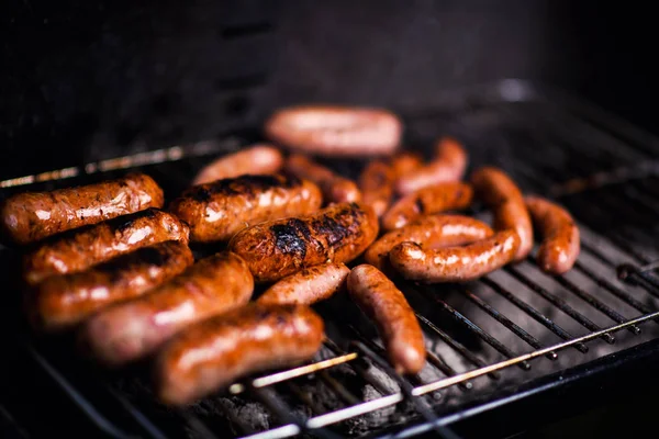 Grilled sausage on the flaming grill — Stock Photo, Image