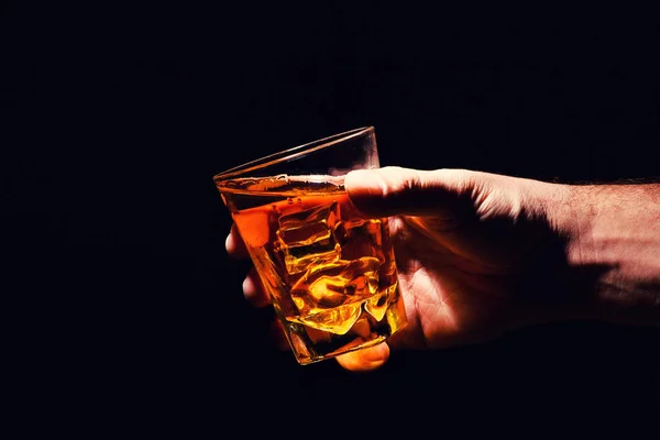 Whiskey glass in a hand of a man — Stock Photo, Image