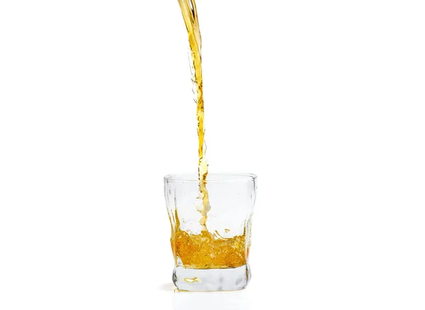 Whiskey with splash on white background, brandy in a glass — Stock Photo, Image