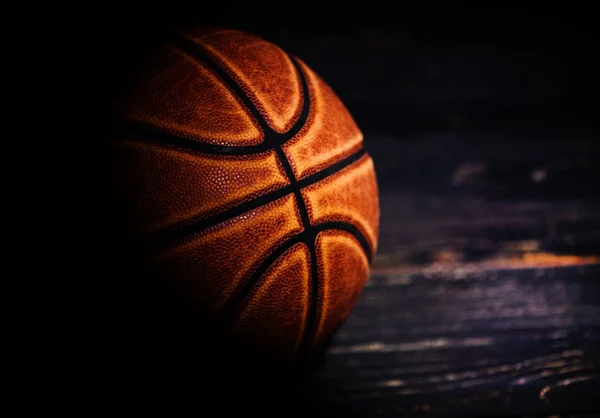 Basketball ball on wooden background. — Stock Photo, Image