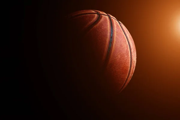 Pelota de baloncesto sobre fondo negro. — Foto de Stock