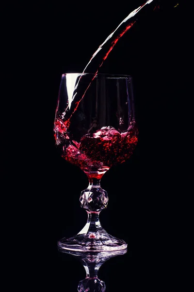 Wine is poured into a glass — Stock Photo, Image