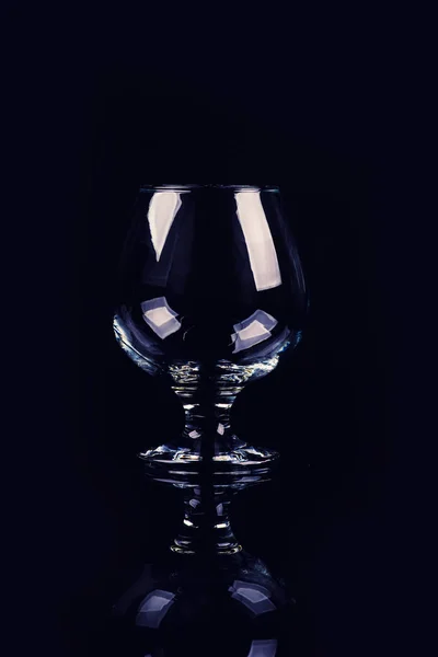 Glass for cognac on black background — Stock Photo, Image