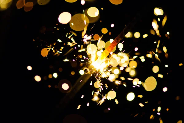 Glowing Sparks in the dark Stock Photo