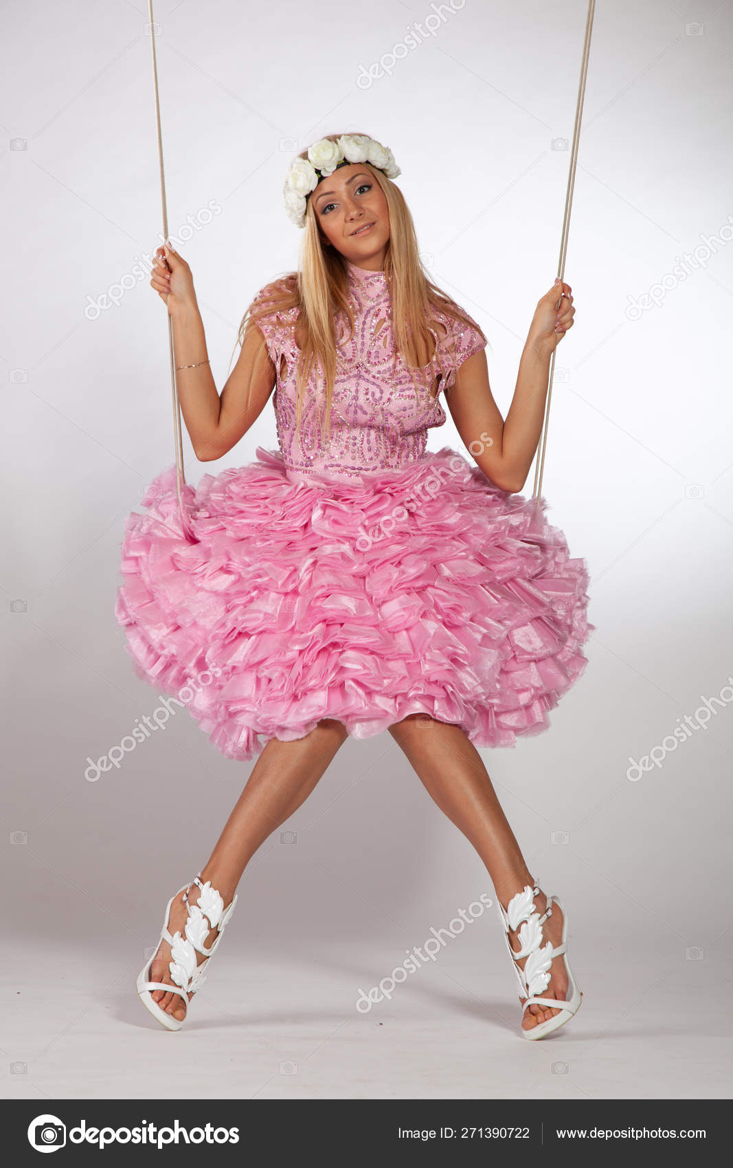 https://st4.depositphotos.com/10086424/27139/i/1600/depositphotos_271390722-stock-photo-girl-swinging-swing-studio-pink.jpg