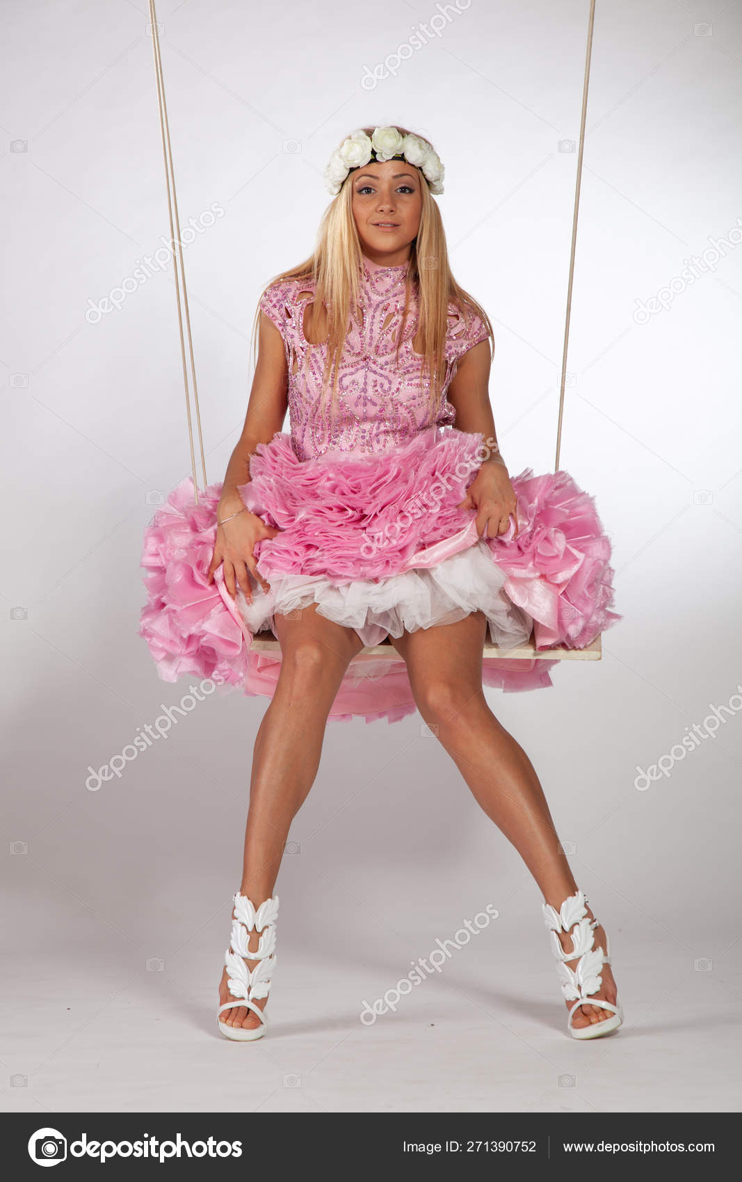 https://st4.depositphotos.com/10086424/27139/i/1600/depositphotos_271390752-stock-photo-girl-swinging-swing-studio-pink.jpg