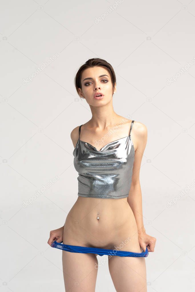young beautiful girl posing in studio, standing in underwear