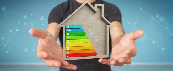 木造住宅の レンダリングのエネルギー評価のグラフを使用して背景をぼかした写真の実業家 — ストック写真