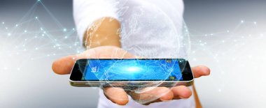 İşadamı cep telefonuyla 3d render planet earth ağ kullanarak arka plan bulanık üzerinde