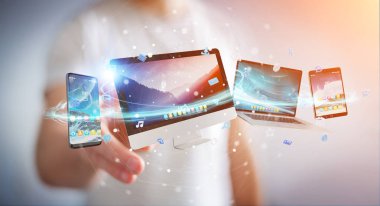 Teknoloji aygıtları ve simge uygulamalarını birbirine bağlayan iş adamı