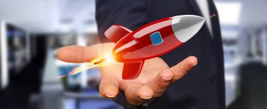 İşadamı üzerinde tutarak ve bir roket 3d render dokunmadan arka plan bulanık