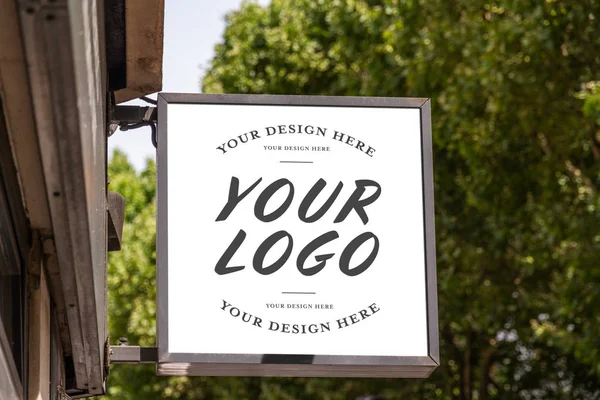 Store brand sign mockup in street