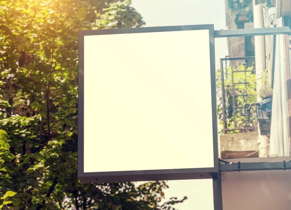 Store brand sign mockup in street