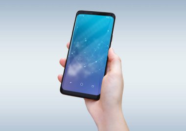 Modern smatphone mockup gri arka plan üzerinde tutan kadın el