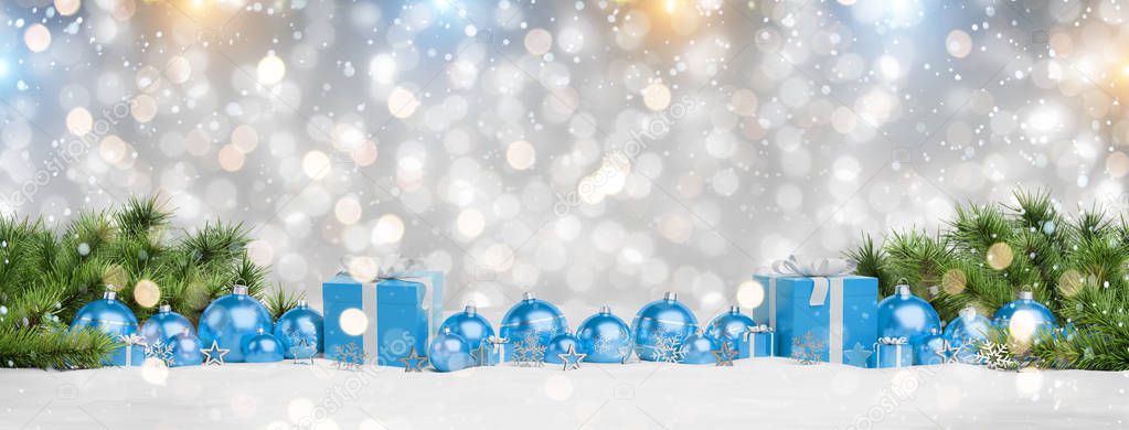 Blue christmas gifts and baubles lined up on grey snowy background 3D rendering