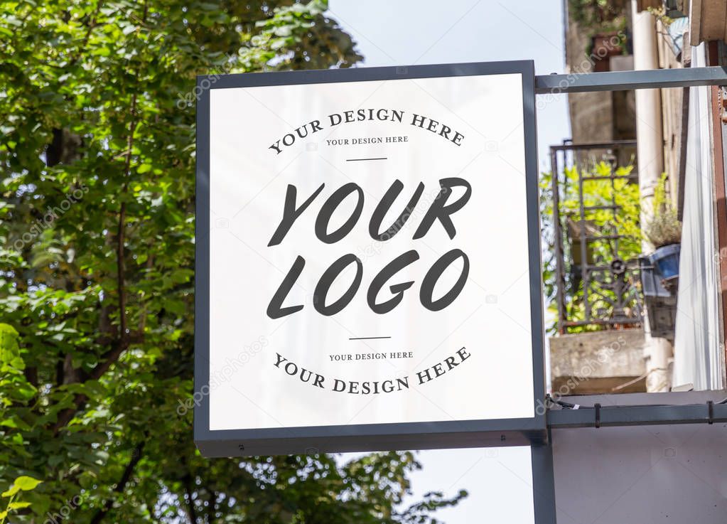 Store brand sign mockup in street