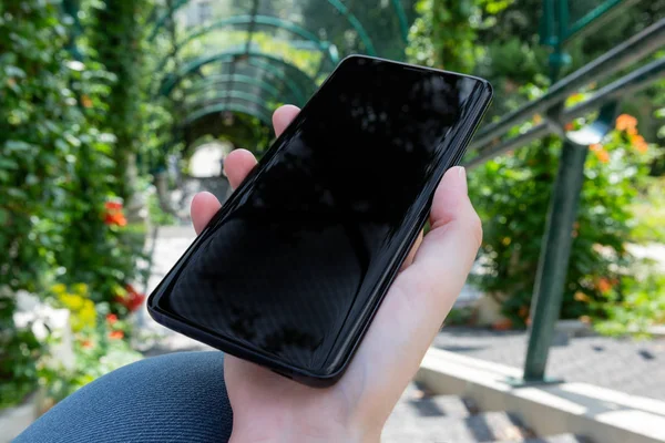 Woman Holding Modern Smartphone Park Mockup — Stock Photo, Image