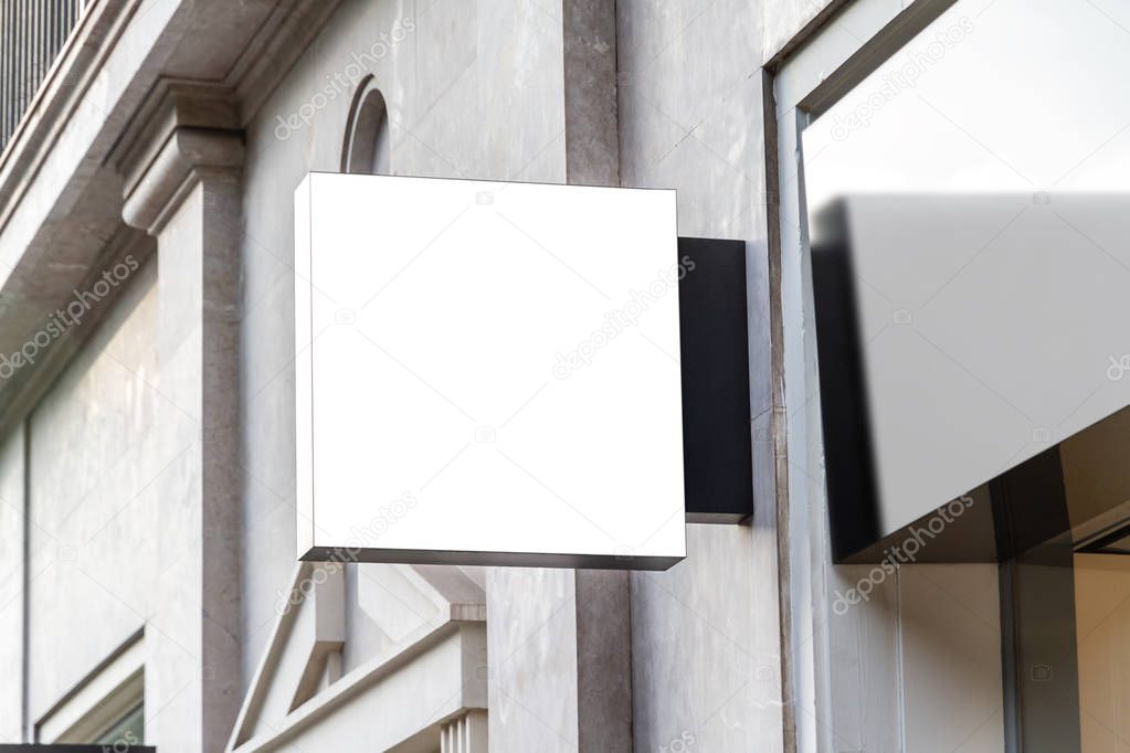 Store brand sign mockup in street on marble wall