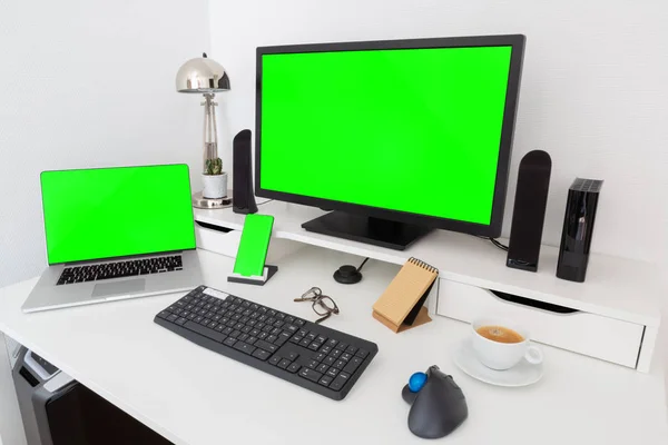 Computer and devices on modern white desk bright interior 3D rendering