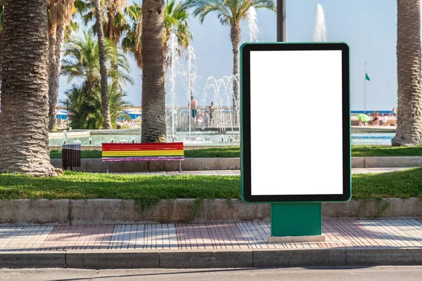 Outdoor billboard advertisement in seaside resort city with palms mockup