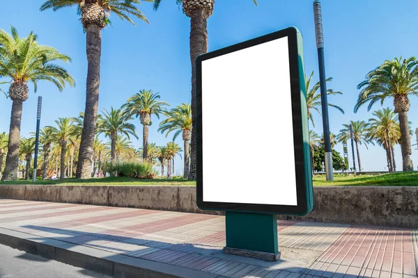 Outdoor billboard advertisement in seaside resort city with palms mockup