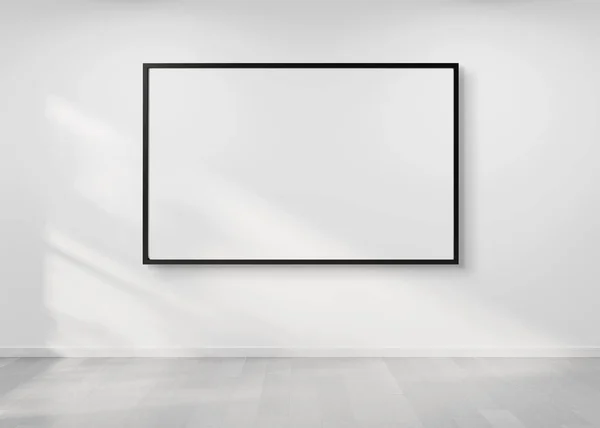 Marco negro colgando en una maqueta de pared 3d renderizado —  Fotos de Stock