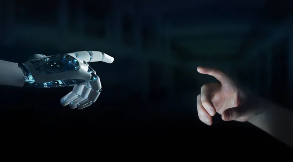 Robot hand making contact with human hand on dark background 3D