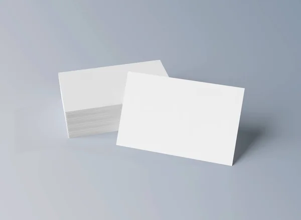 Stapel witte visitekaartjes mockup geïsoleerd op grijs 3D renderi — Stockfoto
