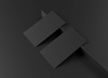 Siyah arka planda iki siyah Amerikan kartviziti. Önde ve arkada boş bir yüzey üzerinde duran Amerikan büyüklüğünde bir kartvizit.