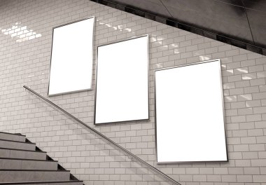 Three vertical billboards on underground stairs wall Mockup. Triptych hoardings advertising in white tiles reflecting tunnel interior. 3D rendering clipart