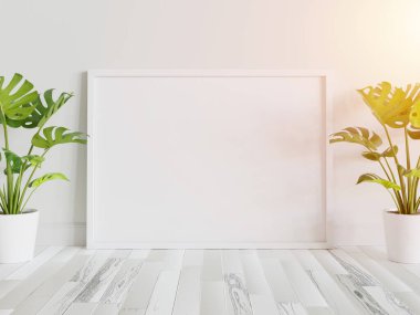 Beyaz çerçeve, iç kısımda, bitkilerin maketi ile birlikte yere dayanıyor. 3 boyutlu bir resimde çerçevelenmiş bir resmin şablonu