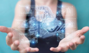 Arka planda bulanık duran ve kabloya dokunan üç boyutlu bir motorun holografik projeksiyonuna sahip bir kadın.