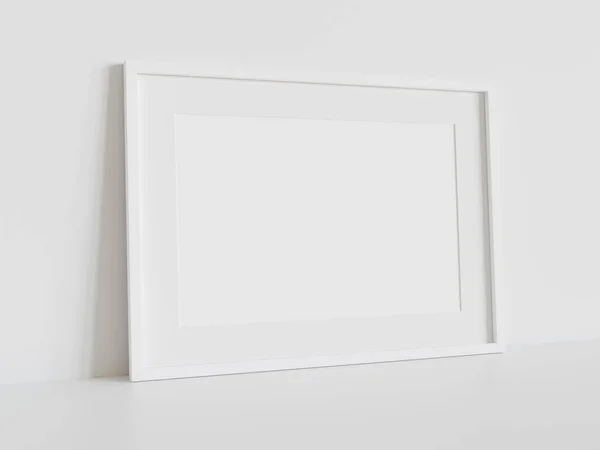 内部モックアップの白い床にもたれて白い長方形のフレーム 壁に額装された画像のテンプレート3Dレンダリング — ストック写真