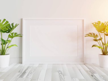 Beyaz çerçeve, iç kısımda, bitkilerin maketi ile birlikte yere dayanıyor. 3 boyutlu bir resimde çerçevelenmiş bir resmin şablonu