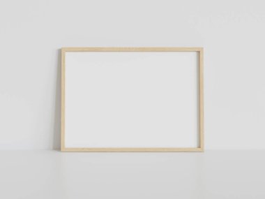 Ahşap dikdörtgen çerçeve, iç döşemede beyaz zemine dayanıyor. 3 boyutlu bir resimde çerçevelenmiş bir resmin şablonu