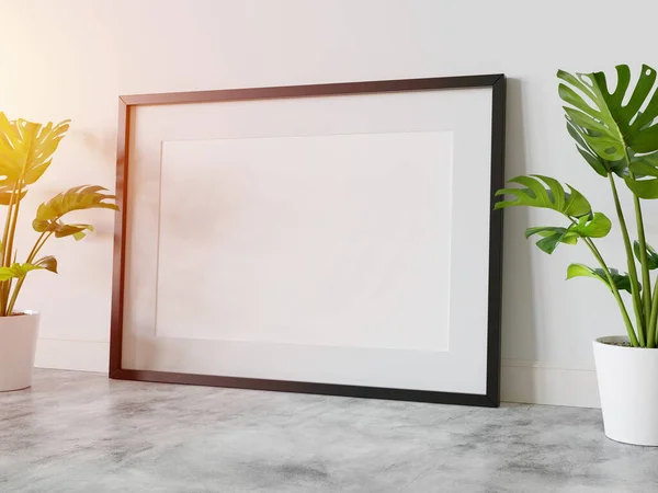 Black frame leaning on floor in interior with plants mockup. Template of a picture framed on a wall 3D rendering