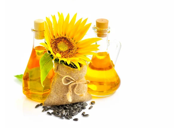 Sonnenblumen Und Samen Kleinen Beuteln Und Ölflaschen Auf Weißem Hintergrund — Stockfoto